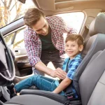 child legally sit in front seat